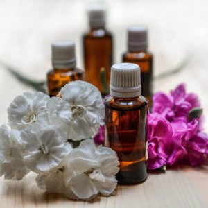 essential oils with white and purple petals