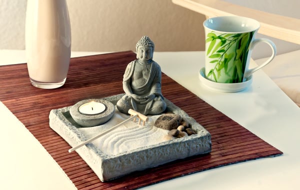 white table with buddhist statue
