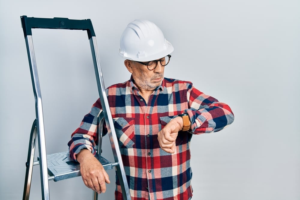 handyman-checking-the-time-serviceseeking